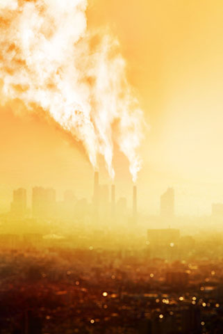 landscape of building with fire billowing out of them