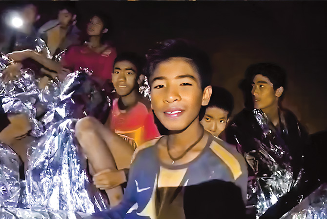 Image of kids being rescued from cave in Thailand