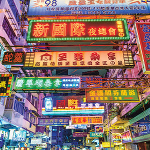 brightly lit billboards written in a foreign language