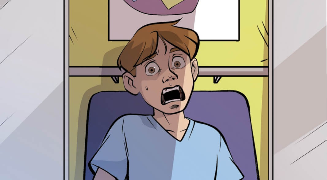 A boy sits in a chair with his mouth open wide and his eyes wide with alarm